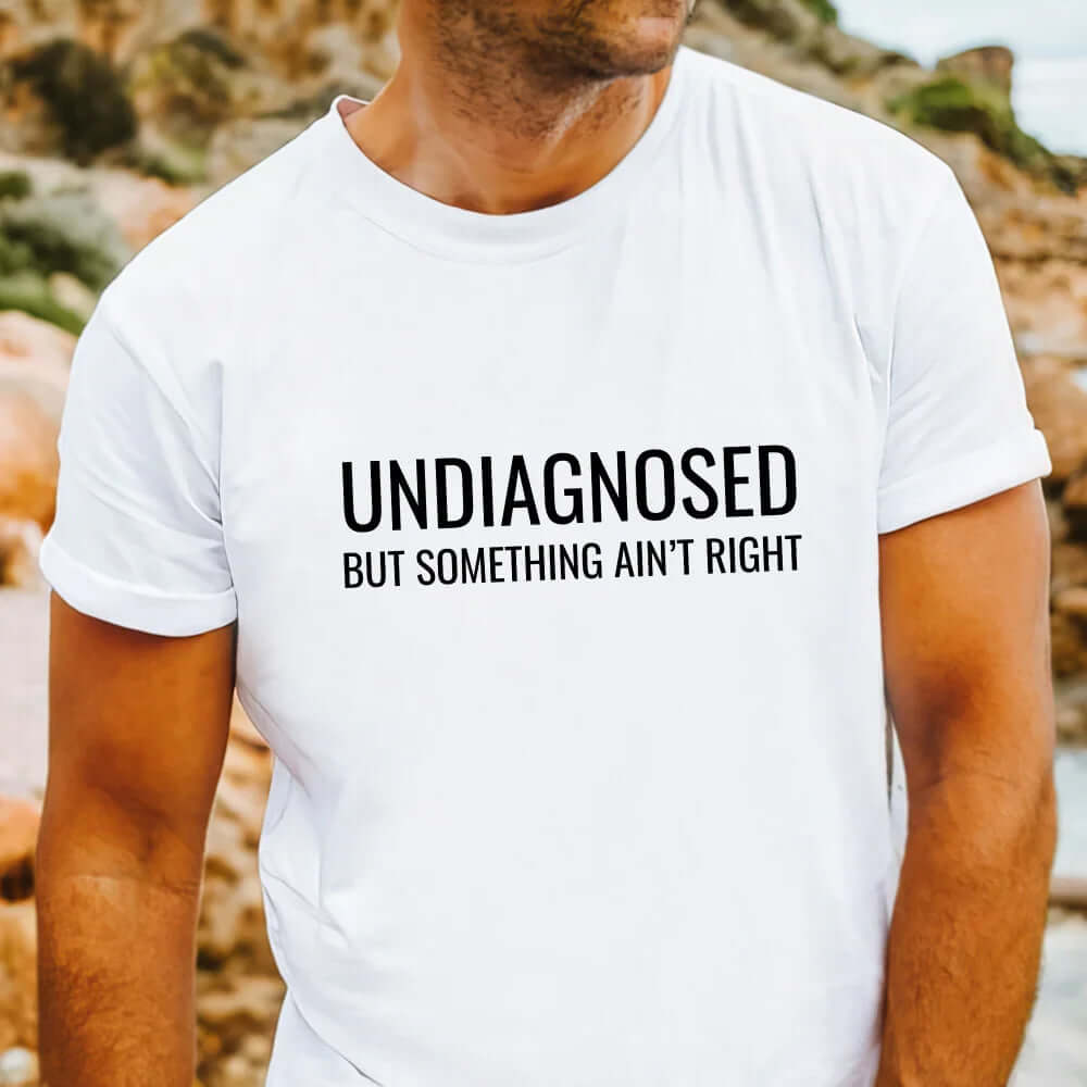 Undiagnosed but something ain't right graphic t-shirt with bold writing on shirt