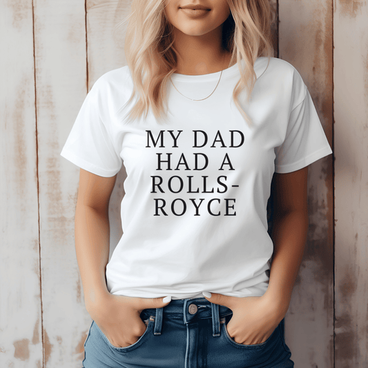White graphic t-shirt with the slogan “My Dad Had a Rolls Royce”, a cheeky pop-culture reference to Victoria Beckham and her famous working-class quote.