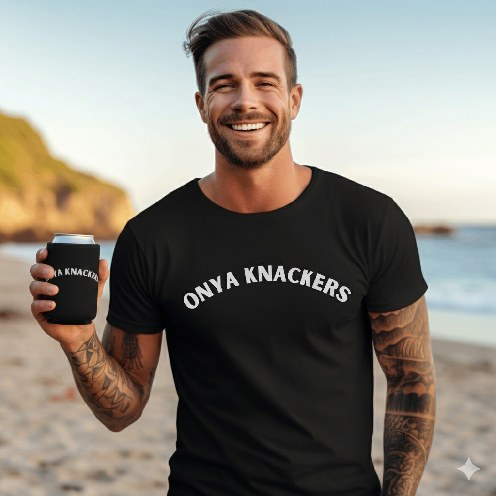 Man wearing a black 'Onya Knackers' t-shirt on a beach holding aonya knackers stubby holder.