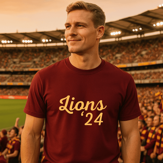 Man wearing a maroon 'Lions '24' t-shirt in a stadium setting