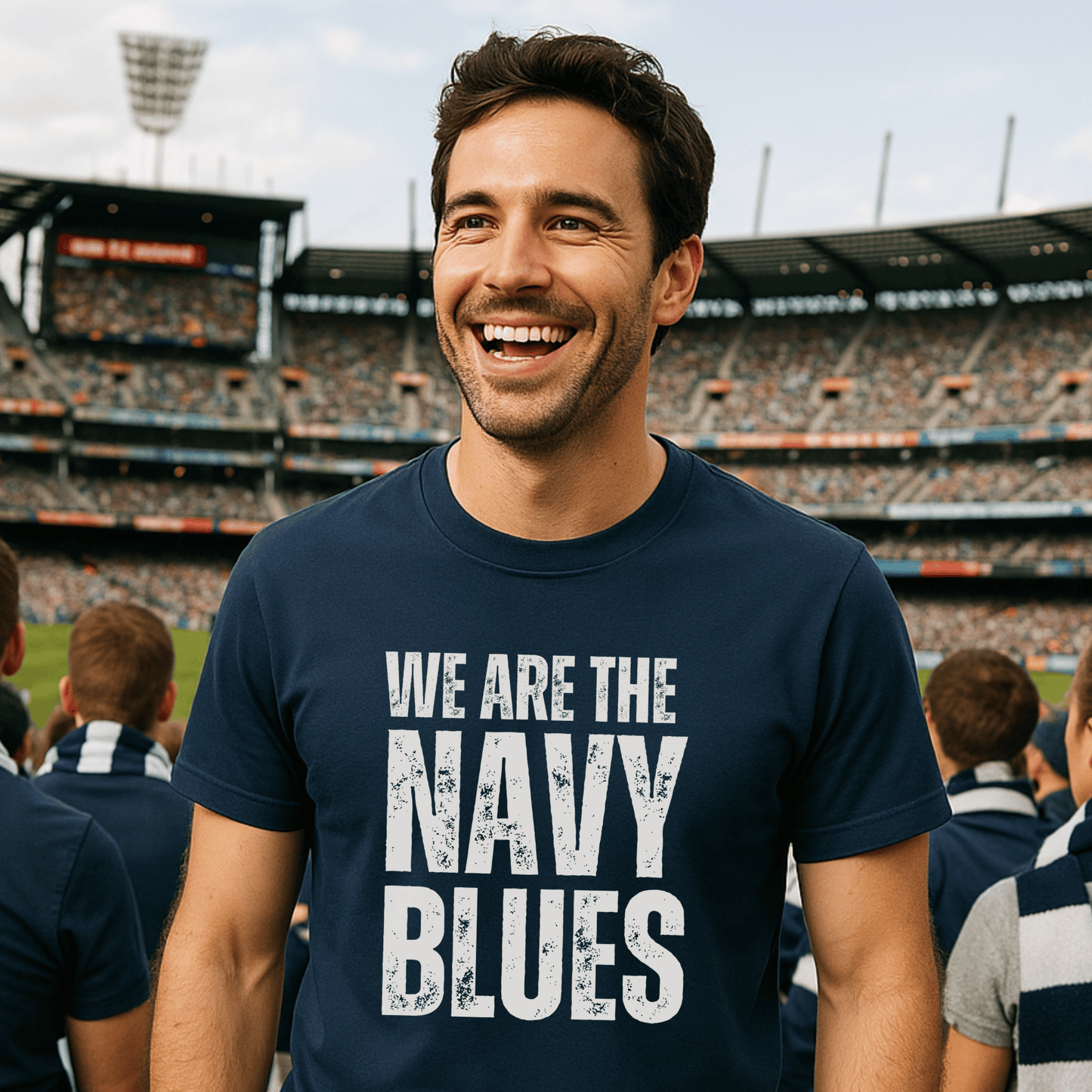 Man wearing a navy blue t-shirt with 'WE ARE THE NAVY BLUES' text at the MCG