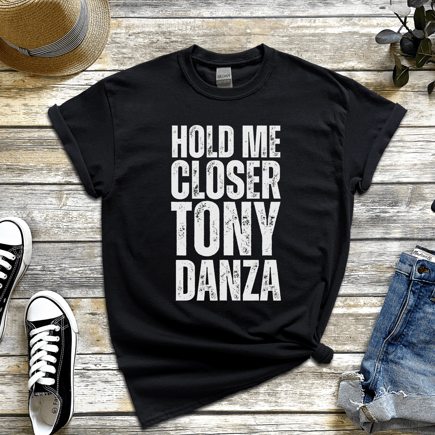 Hold me closer Tony Danza' t-shirt, a funny misheard lyric from Elton John’s Tiny Dancer.