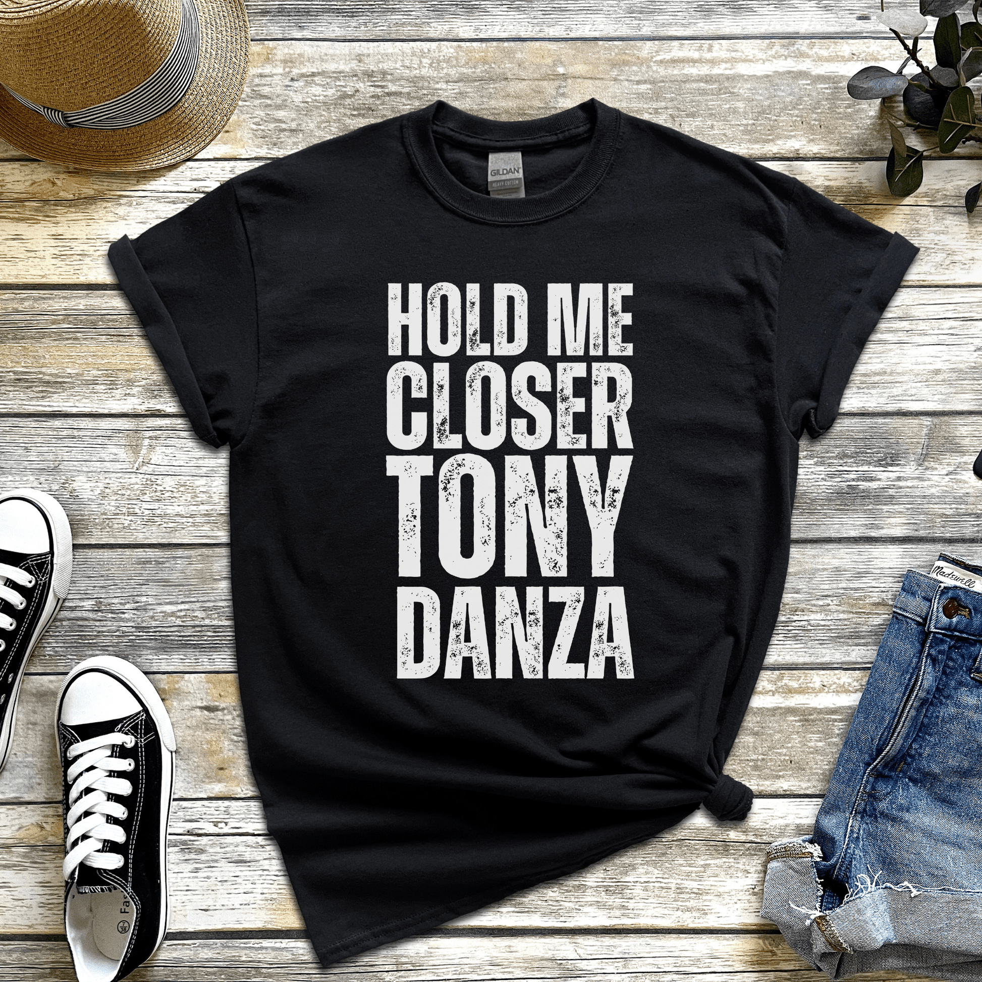 Hold me closer Tony Danza' t-shirt, a funny misheard lyric from Elton John’s Tiny Dancer.