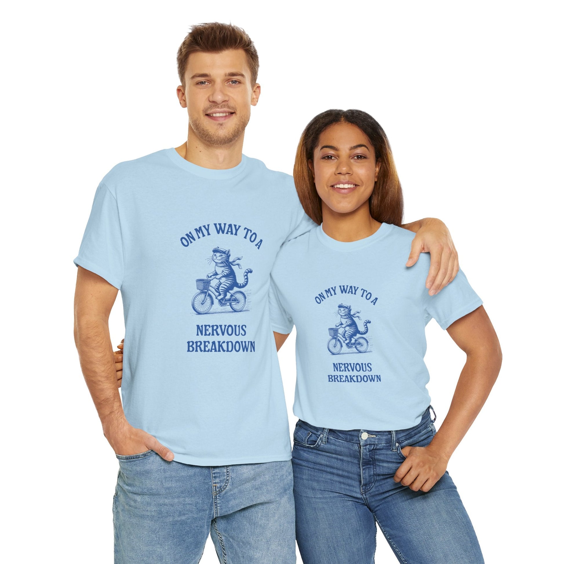 On my way to a nervous breakdown' t-shirt, featuring a cute cartoon cat on a bike, a humorous reminder to raise mental health awareness